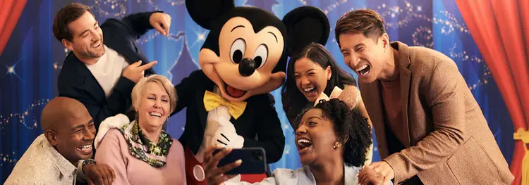 Mickey Mouse meeting attendees in a conference room