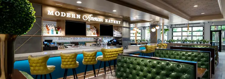 A restaurant and bar decorated with mid century modern décor with a sign that says ' Modern American Eatery'