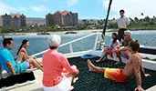 Attendees enjoying a catamaran ride at Disneys Aulani Resort in Hawaii