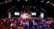 Large gathering of guests in a ballroom during an event
