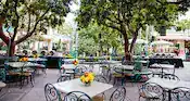 Outdoor tables with floral arrangements at Paradise Garden at Disney California Adventure Park