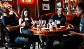 Four friends having fun and drinks Raglan Road