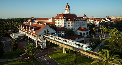A Monorail gliding away from Disney's Grand Floridian Resort & Spa