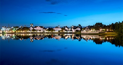 Disney’s Yacht Club Resort reflected in still water at night