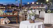 Tables with floral arrangements at the Bayside Marina at Disney's Yacht Club Resort