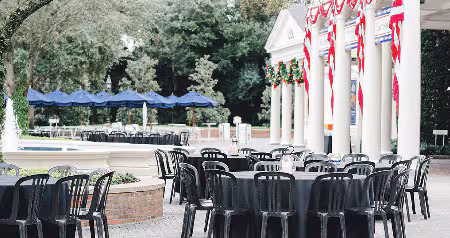 Tables and chairs outside the Rotunda at The American Adventure