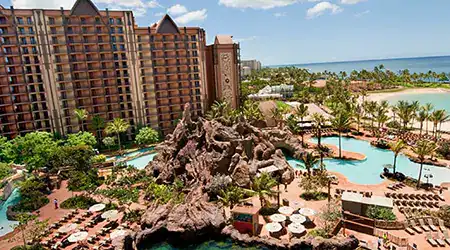 Disneys Aulani Resort in Hawaii overlooking swimming pools, the beach and the water