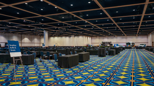 A large exhibit hall set for a convention at Disneyland Hotel
