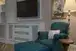 Chair and ottoman next to a TV in a room at Disney's Grand Floridian Resort & Spa