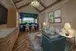 A living room with 2 arm chairs, a sofa and a tea table