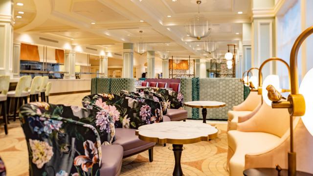Interior of Citricos restaurant, featuring eclectic seating, floral cushions and decorative lamps
