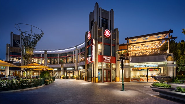 Ballast Point and Wetzel's Pretzels in Downtown Disney District at dusk