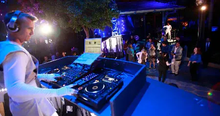 A DJ playing music on a stage